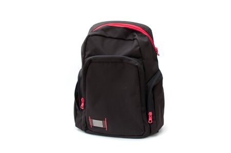 Black backpack with red zipper, image is taken over a white backgroundの写真素材