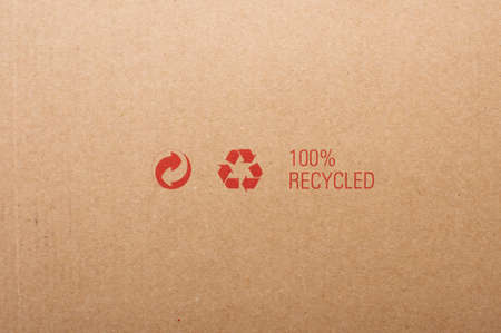 A closed cardboard box, image is taken over a white backgroundの写真素材