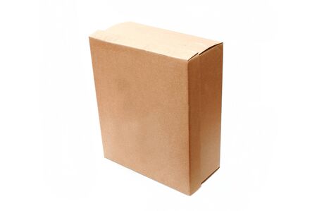 A closed cardboard box, image is taken over a white backgroundの写真素材