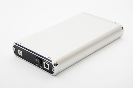 EXternal metallic hard drive case over a white backgroundの写真素材