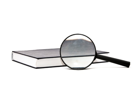 magnifying glass and a book, isolated on whiteの写真素材