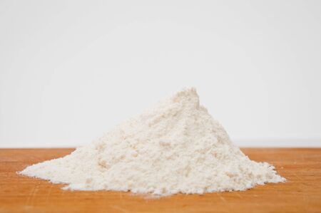 White wheat flour on a wooden tableの写真素材