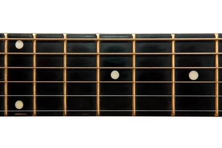 Detail of an yellow, wooden acoustic guitar over a white background