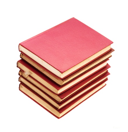 Stack of books, image is taken over a white background.の写真素材