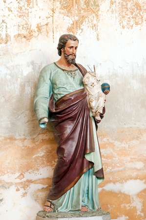 Old ruined religious statue in an old church.の写真素材