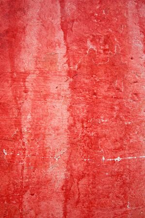 Highly detailed red grunge wall texture with stainesの写真素材