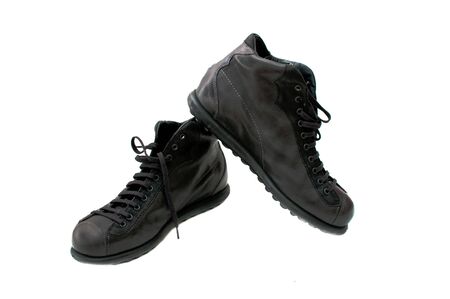 Black leather boots, image is taken over a white backgroundの写真素材