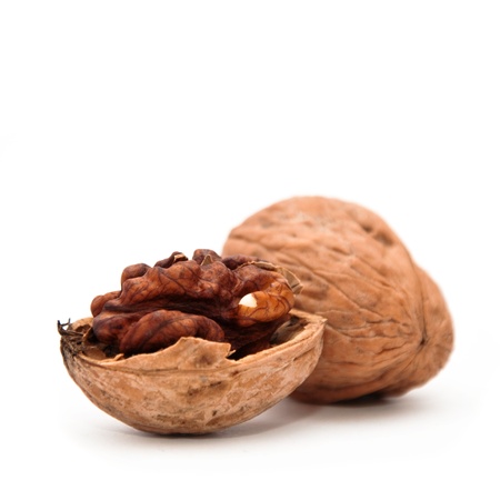 Close up image of walnut over a white background.