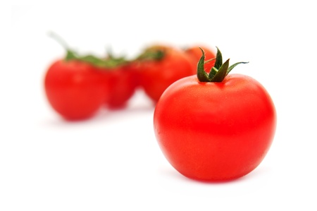 Tomatoes over white backgroundの写真素材