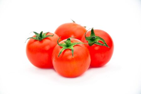 Tomatoes over white backgroundの写真素材