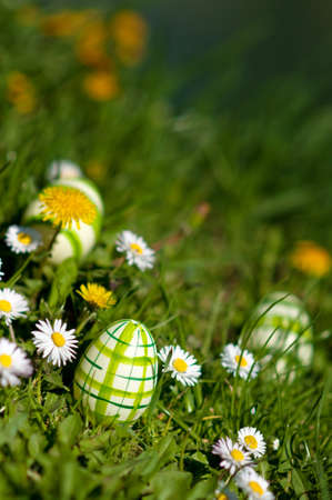 Manually decorated and painted easter eggs in spring glass with flowers