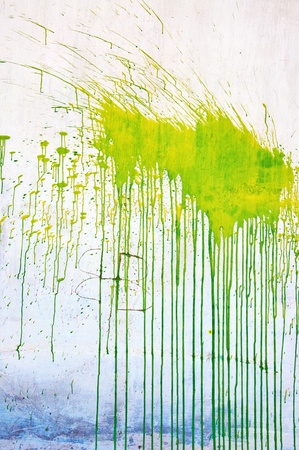 Green grunge stain over a white backgroundの写真素材