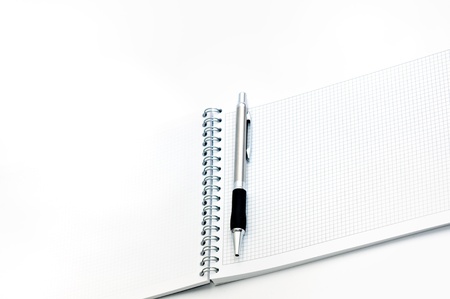Business agenda anda pencil over a white backgroundの写真素材