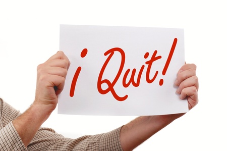 Man is holding a piece  of  white paper, "I Quit" printed on the paper.の写真素材