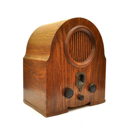 An old vintage wooden radio device over a white backgroundの写真素材