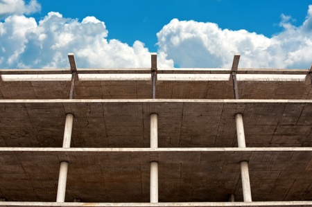 modern urban building under construction against blue skyの写真素材