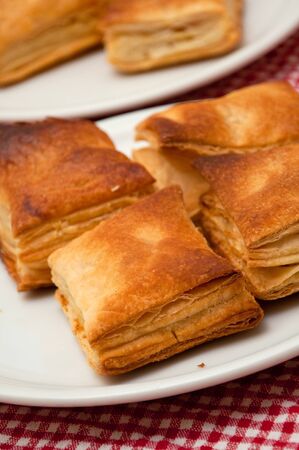Bread puff pastry on a plate on a kitchen tableの写真素材
