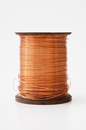 Copper wire rolled up on a spoolの写真素材