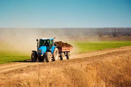 Tractor in the field, agricultural season is startingの写真素材