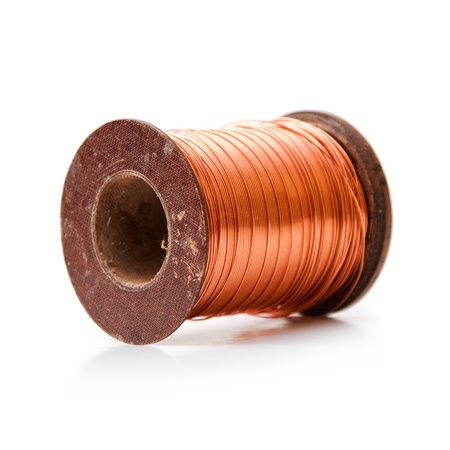 Copper wire rolled up on a spoolの写真素材