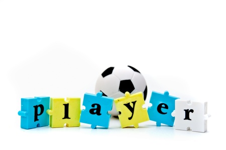 Small soccer ball and a word puzzle pieces forming a word  Playerの写真素材