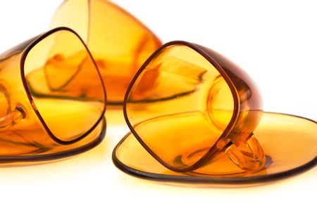 yelllow glass tea cups against the white backgroundの写真素材