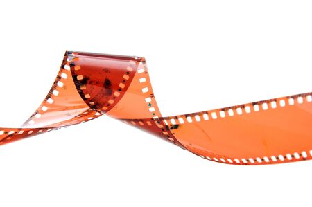 Overexposed old camera film strip over a white backgroundの写真素材