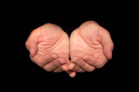 Male empty hands on a dark backgroundの写真素材