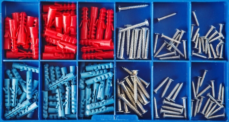 Set of jack screws arranged in blue plastic toolboxの写真素材