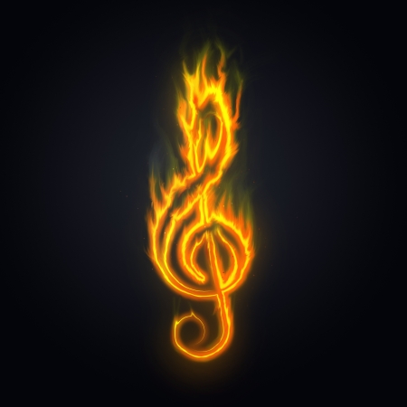 Treble clef, music or violin key on fire over a dark background.の写真素材