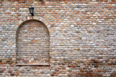 beautiful brick wall and a black street lanternの写真素材