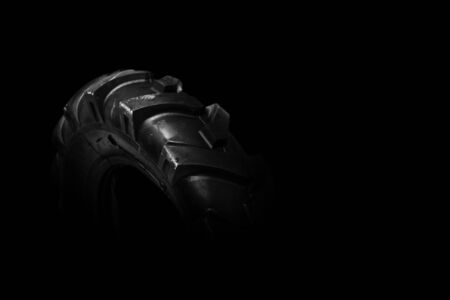 New, unused black cultivator tyres. Agriculture and farming background image.