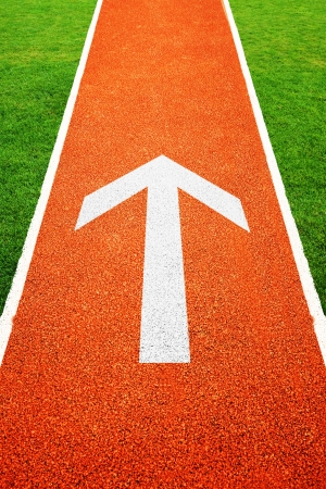 Arrow on athletics all weather running trackの写真素材