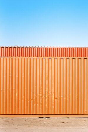 Train cargo containers. Orange metal transport container texture.の写真素材