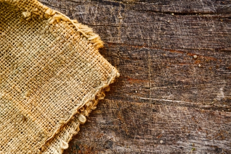 Burlap jute canvas texture and old wood texture as backgroundの写真素材