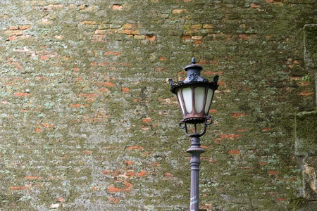 Street lantern against the old brick wallの写真素材