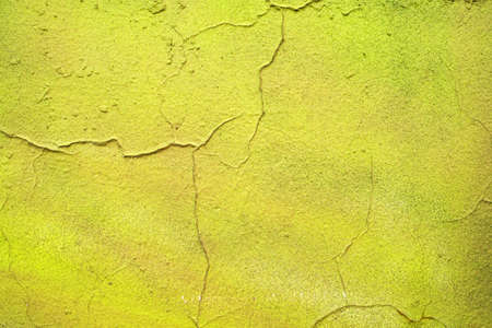 Texture of cracked obsolete old green wallの写真素材
