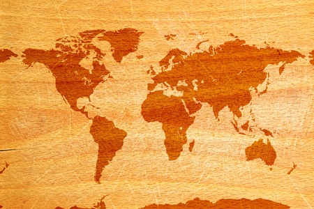 World map on wooden grunge textured background