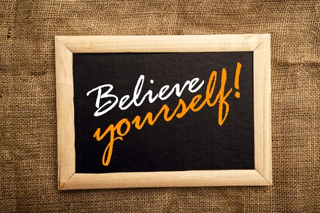 Believe yourself, motivational messsage on blackbaord.の写真素材