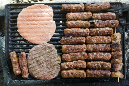 grilled meat on the barbeque plate, close up imageの写真素材