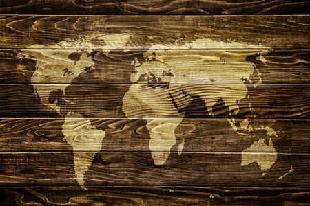 World map on wooden grunge textured backgroundの写真素材