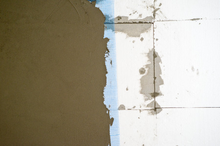 Styrofoam isolation. Putting styrofoam on interior walls for thermal insultion.の写真素材