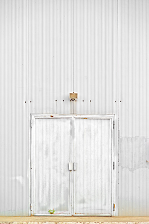 Warehouse door, old obsolete metal door.の写真素材
