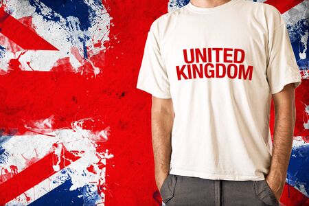 Man in white shirt with title United Kingdom, UK flag in backgroundの写真素材