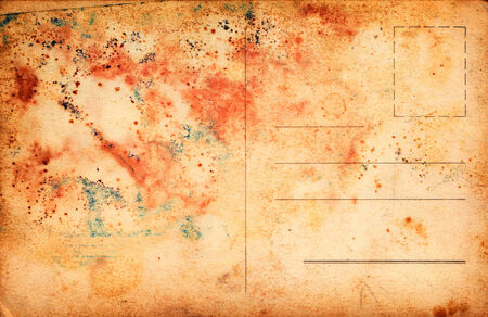 grunge paper postcard as background textureの写真素材