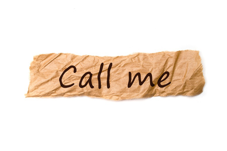 Call me note on crumpled paper over white backgroundの写真素材