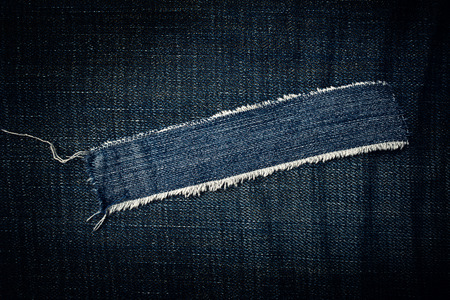 Torn blue jeans texture as copy space, denim texture