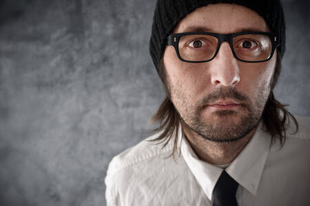 Businessman portrait with cnervous look. Adult artistic unshaven businessman.の写真素材