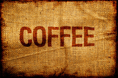 Hesian sacking with Coffee title, grunge backgroundの写真素材