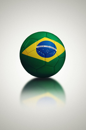 Soccer ball with Brazil flag on gray background, 3d render の写真素材